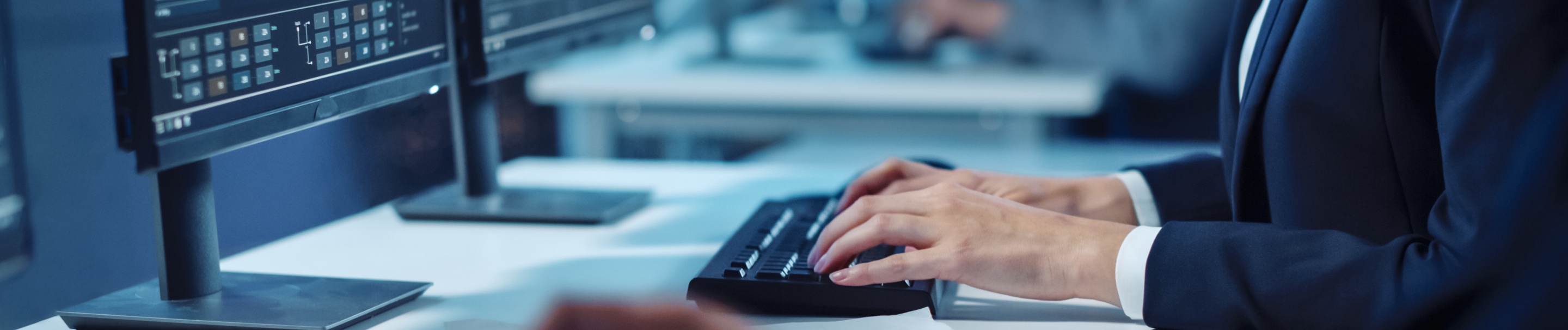 A man working on a computer connected to the Ethernet service