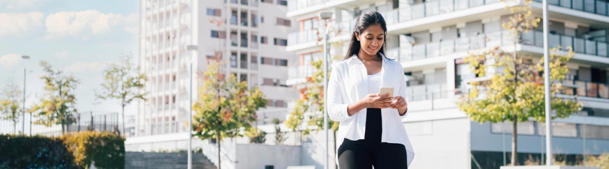 Employee looking at a visualization dashboard on a phone to improve operations with big data.