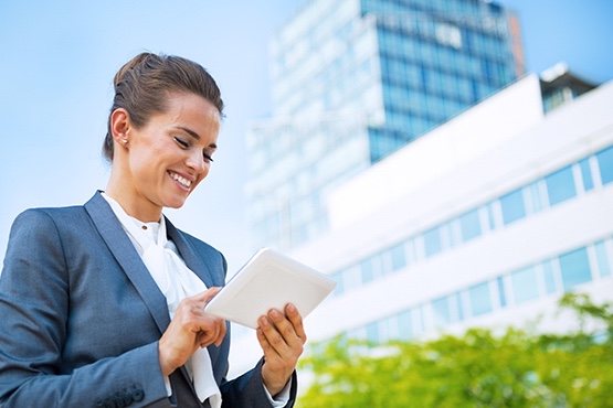 A woman accessing wireless LTE on a tablet