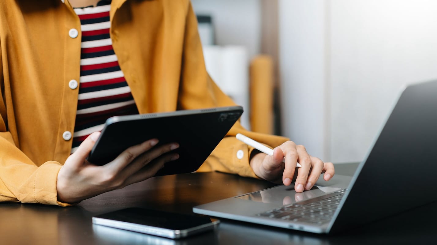 Professional cybersecurity service team analyzing client data on desktop in modern office, collaborating to develop strategic risk management and incident response plans